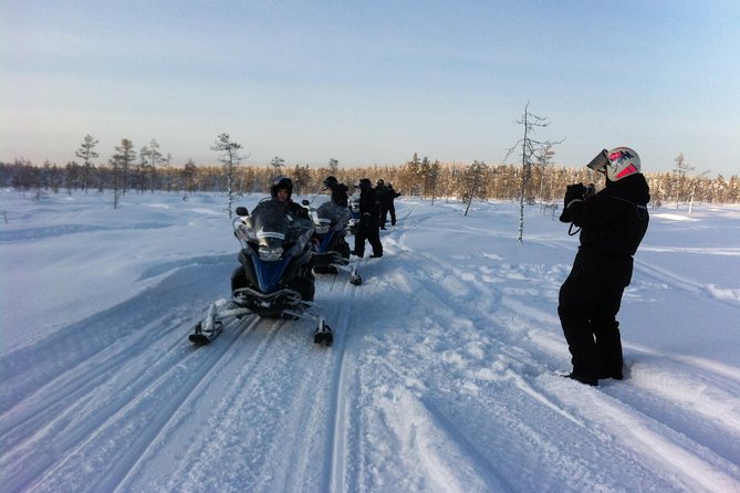 1-Hour Snowmobile Safari Experience - Walking 200 meters to the machines