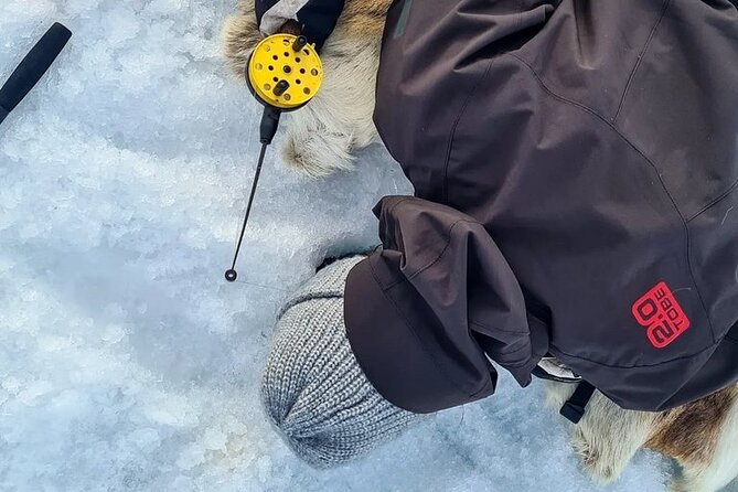 Arctic Fishing & Open Fire Cooking - Drilling through Lake Inari’s winter ice