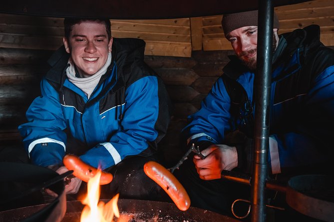 Evening Escape - Snowmobile safari and campfire in Rovaniemi - Riding through the snowy forest