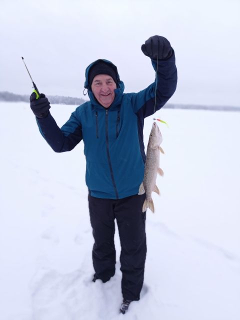 From Helsinki: Bodom Lake Ice Fishing with Food & Drinks - Learning to drill the hole and use the pilkki