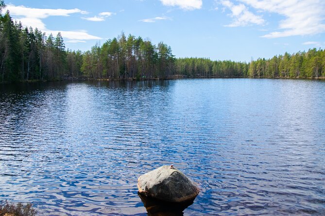 Helsinki: Nuuksio National park hiking with campfire lunch - Lakes, viewpoints, plants, and Finnish stories