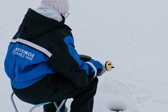 Ice Fishing by Snowmobile in Levi - Learning to cut a hole in the frozen lake