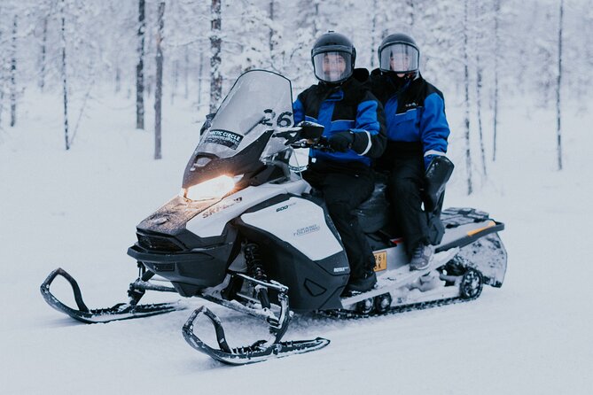 Ice Fishing by Snowmobile in Levi - Getting dressed for three hours in serious cold