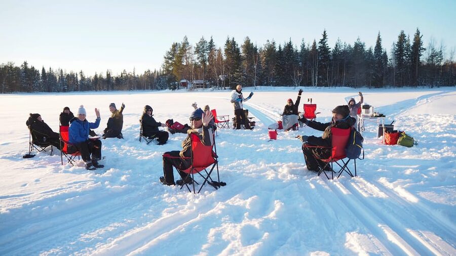 Ice fishing program in Lapland - Fire, Blankets, and Winter Comfort