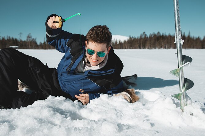 Lappish Lunch Break -Snowmobiling, ice fishing and tasty food - Guide quality and the feel of the day