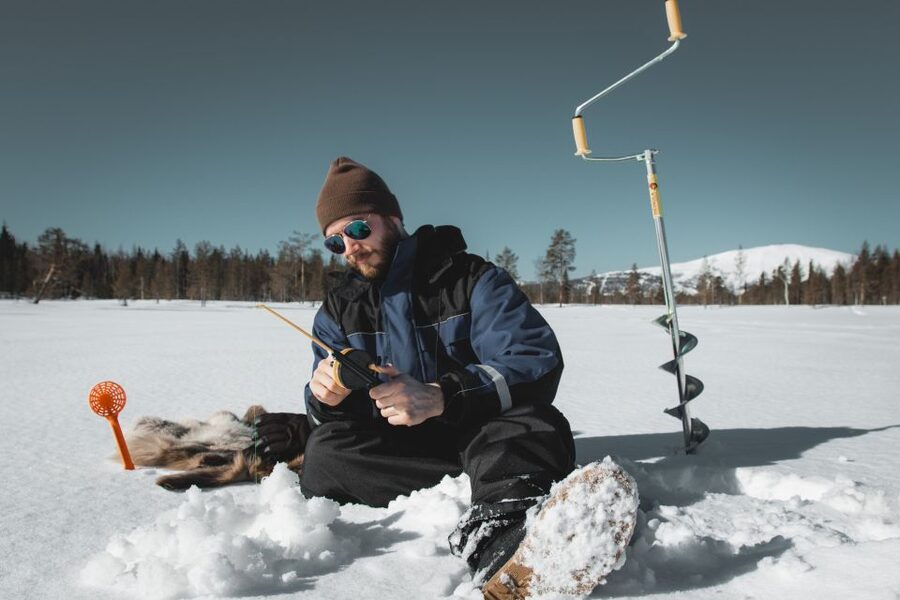 Levi: Finnish Ice Fishing Tour by Car - Getting dressed for two and a half hours outside