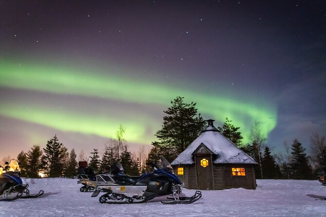 Levi Northern lights by snowmobile - Getting suited up for a shared snowmobile