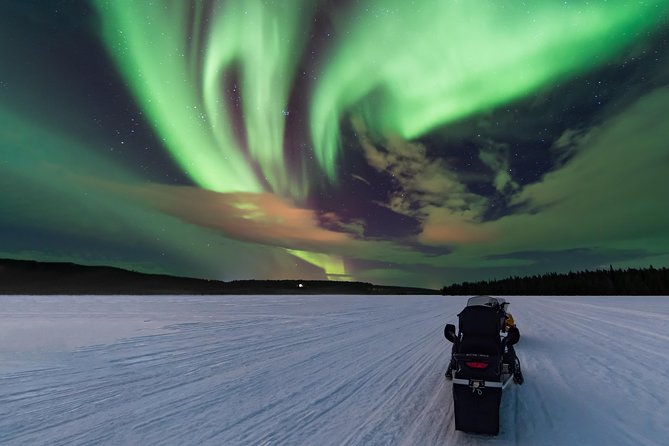 Northern Lights Hunting with Snowmobiles - Riding into the Lappish night