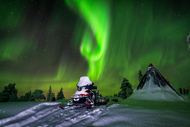Northern Lights Snowmobile Sleigh Ride - Riding by snowmobile sleigh through the countryside