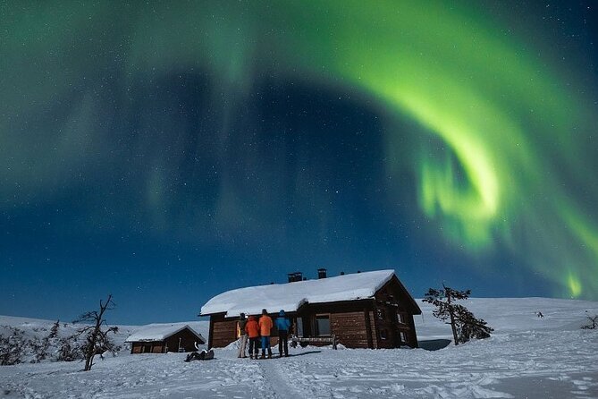 Private Group: Northern Lights Hunt 4x4 SUV with Aurora guarantee - Firelight, a Kota hut, and a frozen river