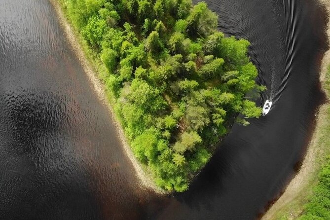 Private Guided Fishing Boat Tour in Rovaniemi - Taking a private boat onto the Ounas River