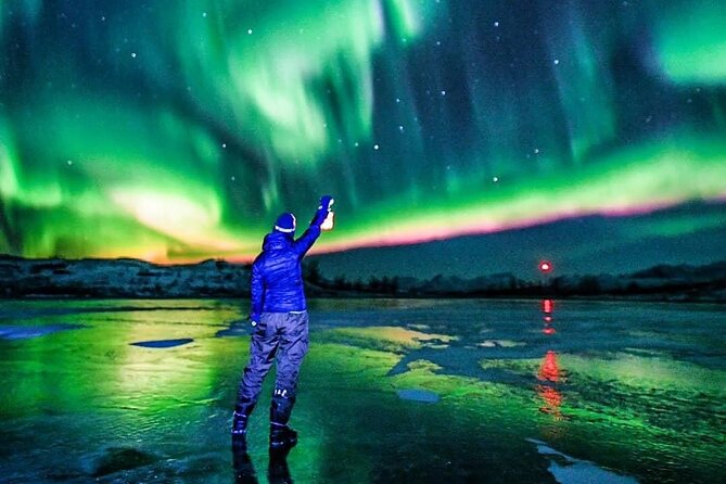 Reflections of the Northern Lights - A forest viewpoint and an uncertain sky