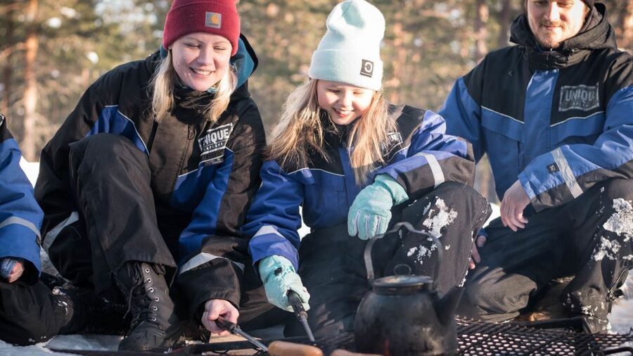 Rovaniemi: Family Snowmobile Safari with Campfire and Snacks - Getting suited up at Wild Nordic Finland Safari Center