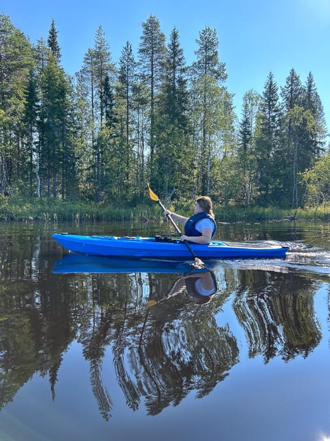 Rovaniemi: Guided Wilderness Kayaking Adventure - Getting set up with a kayak, canoe, and lifejacket