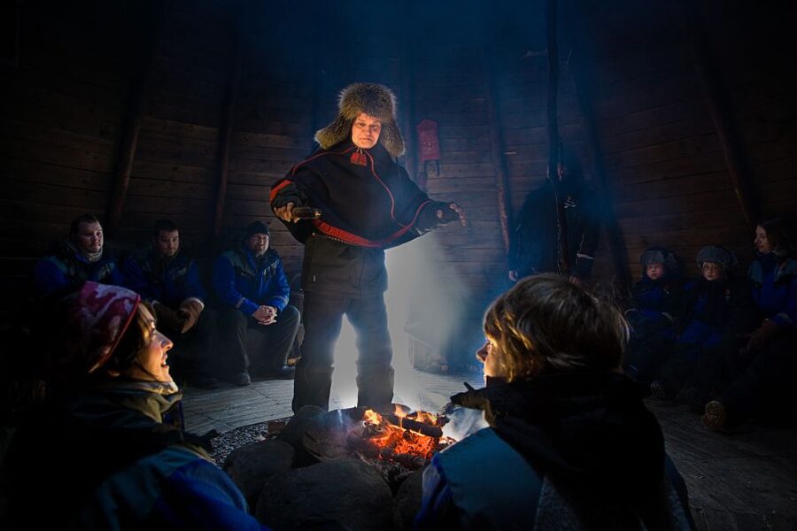 Rovaniemi: Santa’s Village & Snowmobiling to Reindeer Farm - Santa Claus Village, with a clock to watch