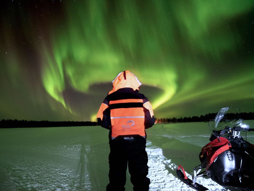 Rovaniemi: Search for Northern Lights Snowmobiling Trip - Riding through the snowy forest