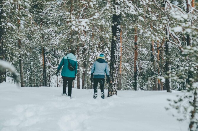 Rovaniemi: Snowshoeing in a magical snowy forest - A fire, hot juice, snacks, and Finnish-style sausages