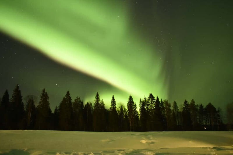 Rovaniemi: Snowtrain to Northern Lights Camp - A bonfire beside a remote Lappish hut