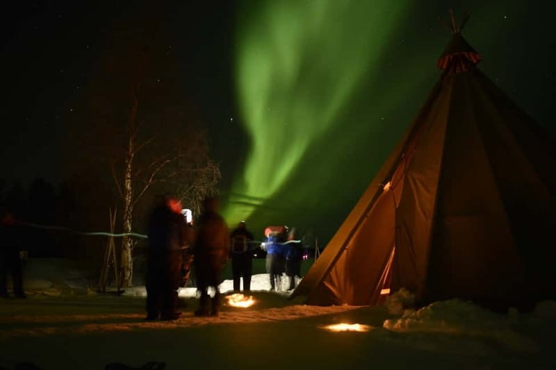 Rovaniemi: Snowtrain to Northern Lights Camp - Walking through snow under the moon
