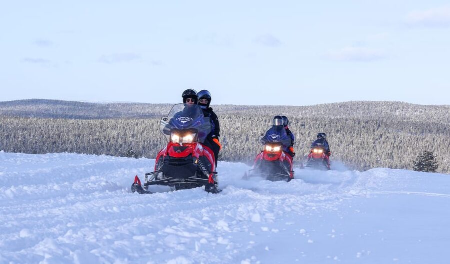 Saariselkä: Ice Fishing Safari by Snowmobile - Snowmobile tracks through forests and open fells