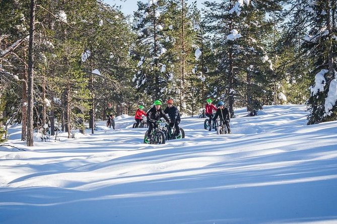 Scenic electric fat bike group ride in Rovaniemi - Crossing the Kemijoki and the Lumberjack’s Candle Bridge