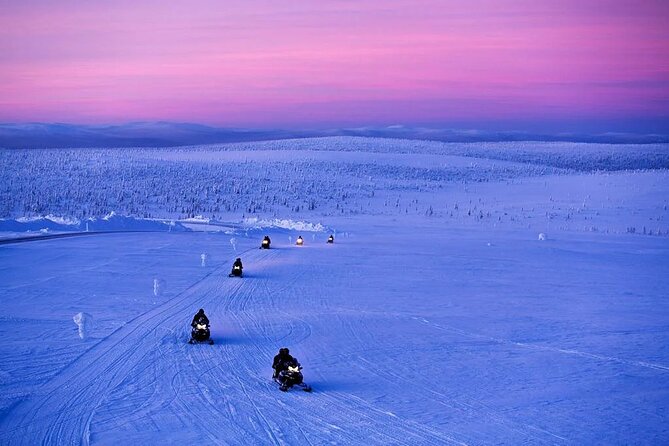 Snowmobile and Ice Fishing Experience - Snowmobiling through forest and lake country