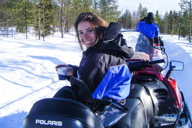 Snowmobile Safari in the Forest - Looking for tracks in the Kätkävaara snow