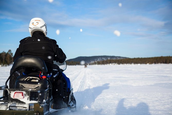 Snowmobile Safari to Lake Inari, meet & feed Reindeers, Lunch - The island, teepee, and reindeer