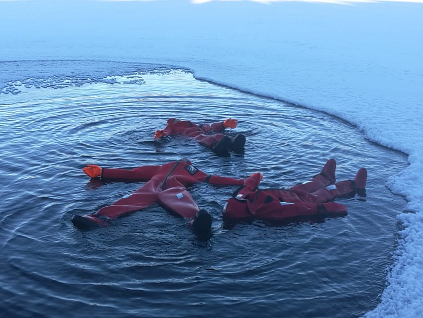 Ylläs: Lake Ylläsjärvi Ice-Floating Experience - Putting on the rescue suit